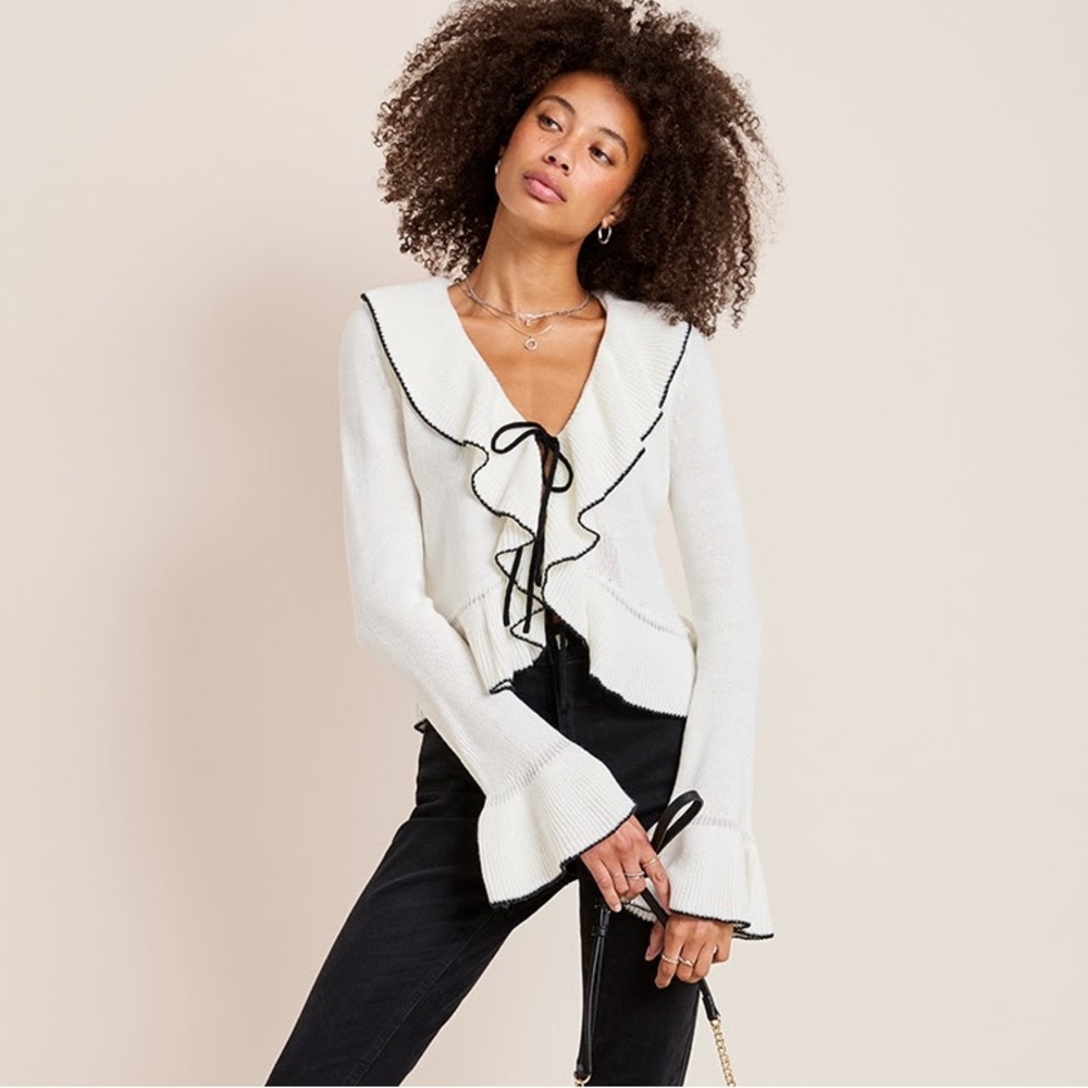 Francesca’s White Ruffled Sweater with Black Trim